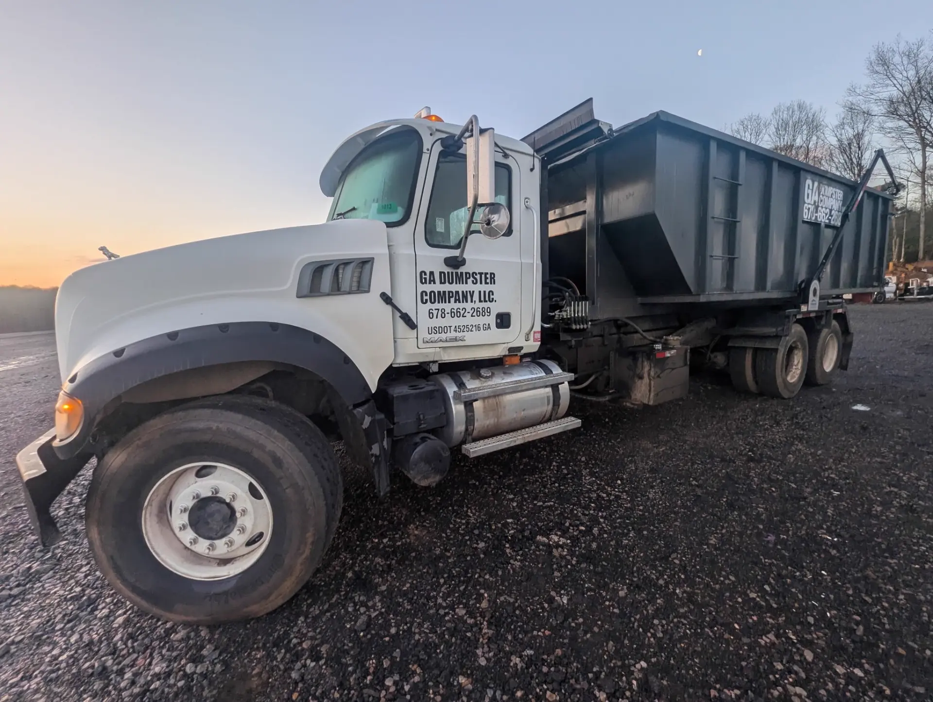 GA Dumpster Company truck at sunset
